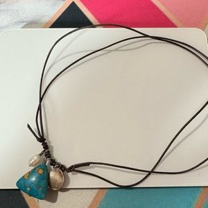 Necklace on leather rope with turquoise and mother of pearl